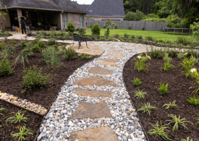 Low angle photo of a flagstone pathway.